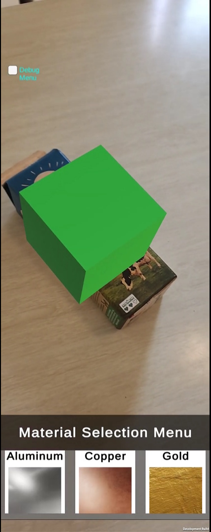 Early AR prototype with a simple green cube placed on the tracked milk carton