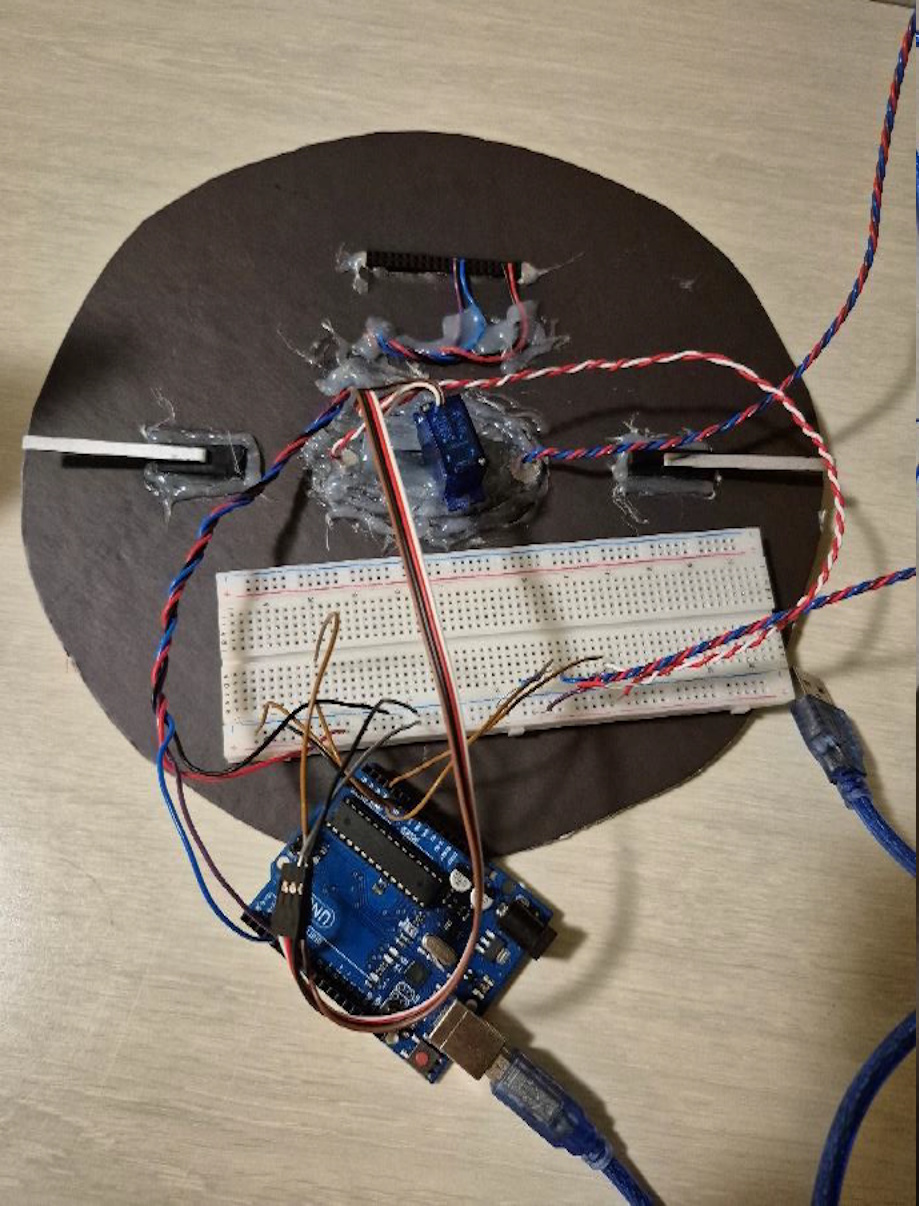 Rear view of the prototype showing Arduino, breadboard, and wiring