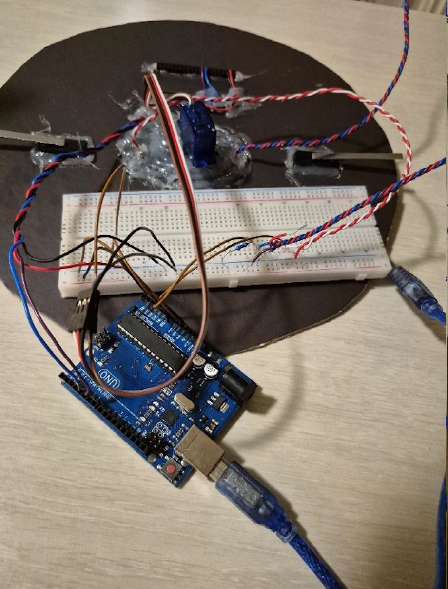 Close view of the Arduino and breadboard section of the racing wheel