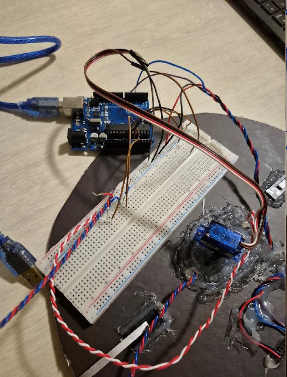 Side angle of the prototype hardware showing wiring and mounting